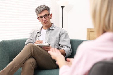 Professional psychologist working with patient in office