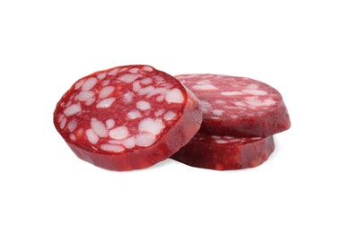 Photo of Pieces of delicious dry cured sausage isolated on white