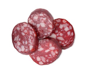 Photo of Pieces of delicious dry cured sausage isolated on white, top view