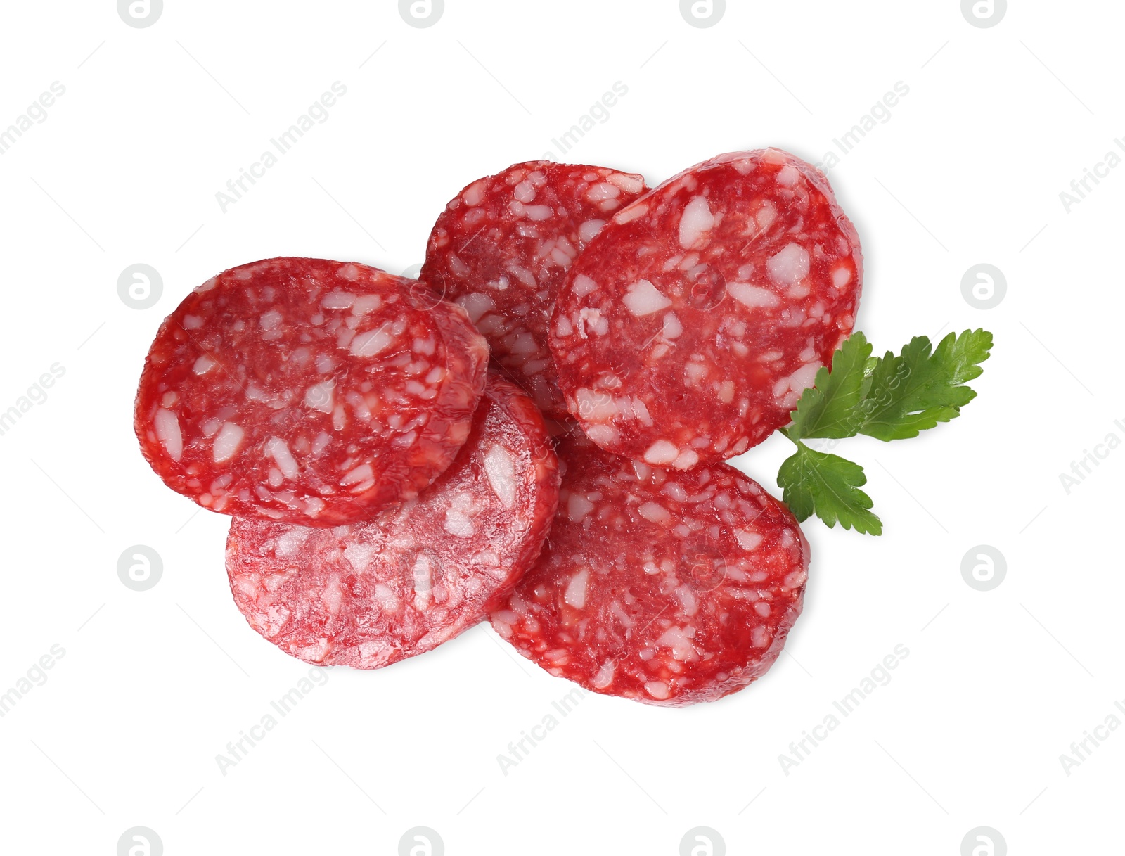 Photo of Pieces of delicious dry cured sausage and parsley isolated on white, top view