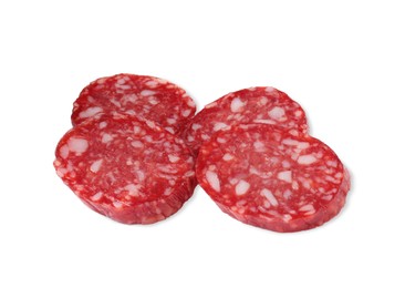 Photo of Pieces of delicious dry cured sausage isolated on white