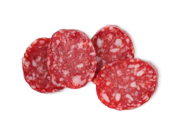 Pieces of delicious dry cured sausage isolated on white, top view