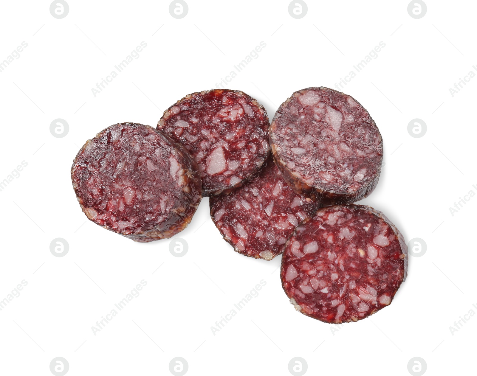 Photo of Pieces of delicious dry cured sausage isolated on white, top view