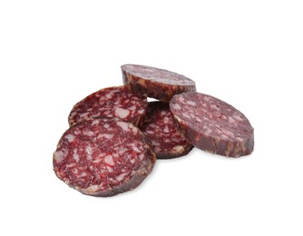 Photo of Pieces of delicious dry cured sausage isolated on white