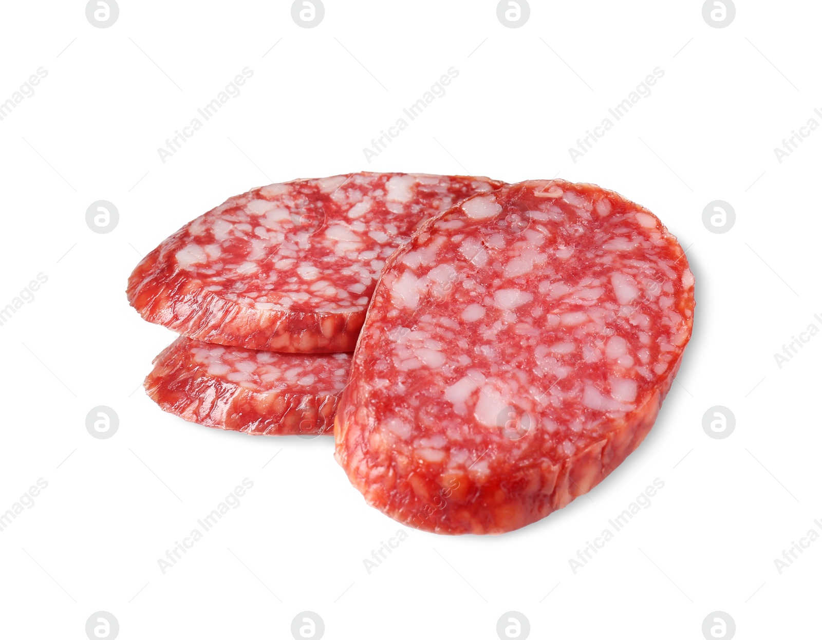 Photo of Pieces of delicious smoked sausage isolated on white