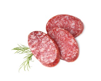 Pieces of delicious smoked sausage and dill isolated on white, top view