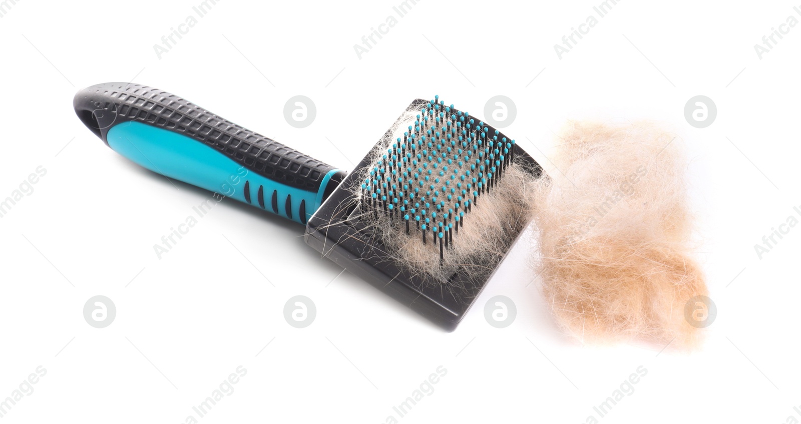 Photo of Grooming brush and pile of pet's hair isolated on white