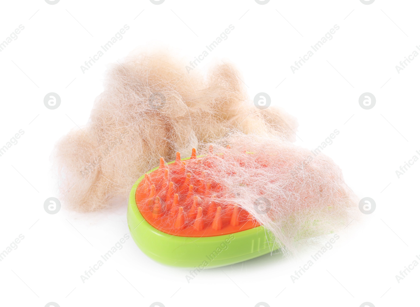 Photo of Grooming brush and pile of pet's hair isolated on white