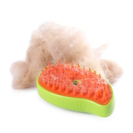 Photo of Grooming brush and pile of pet's hair isolated on white