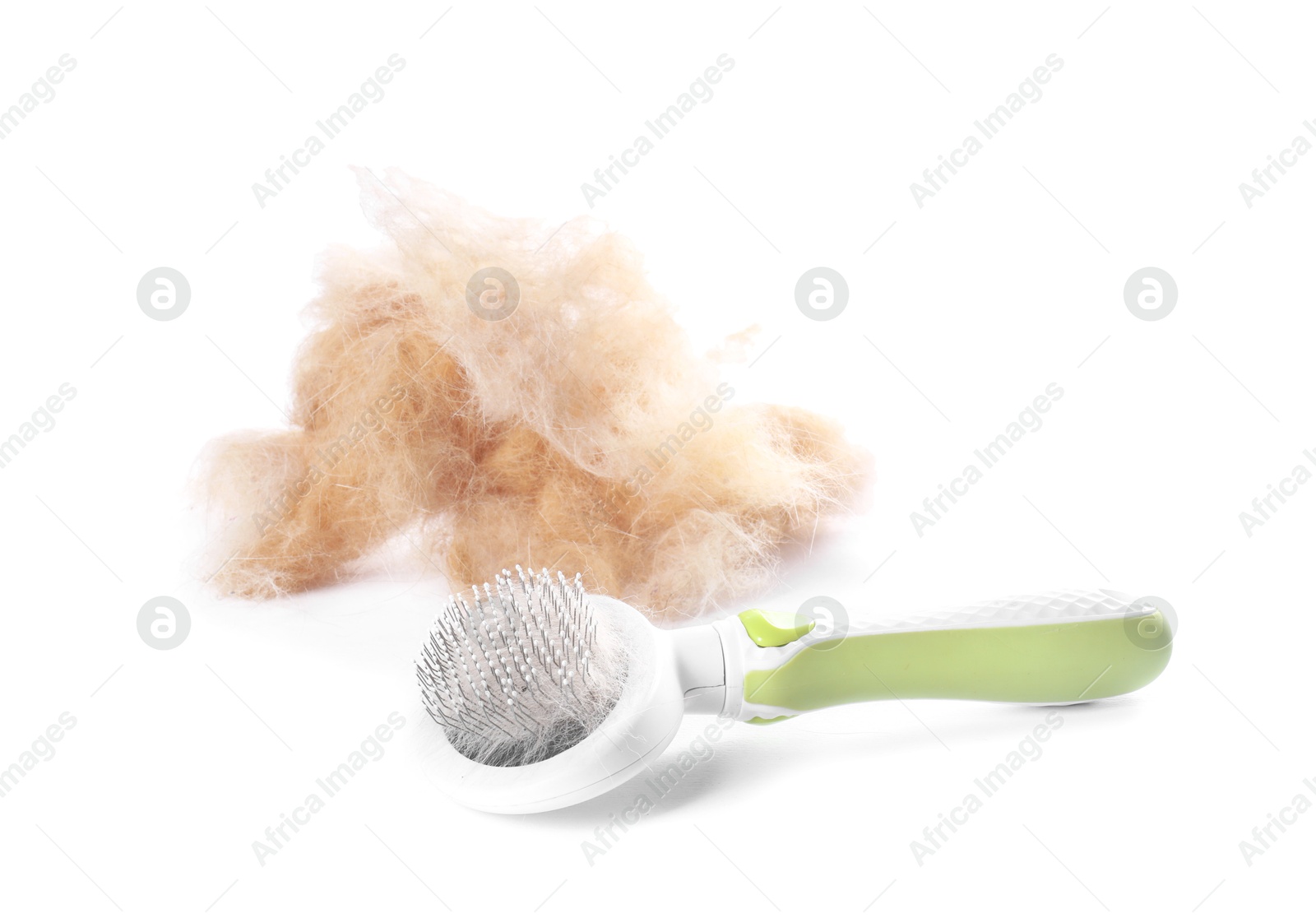 Photo of Grooming brush and pile of pet's hair isolated on white