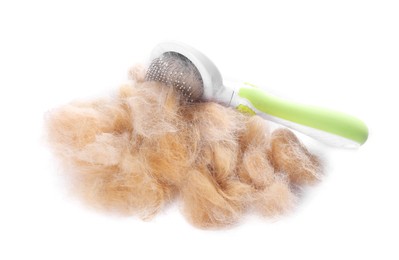 Photo of Grooming brush and pile of pet's hair isolated on white