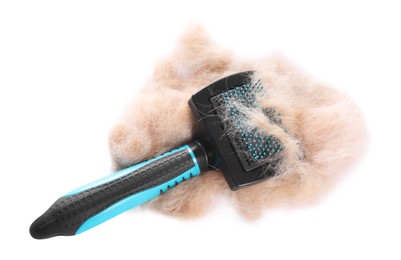 Photo of Grooming brush and pile of pet's hair isolated on white, above view