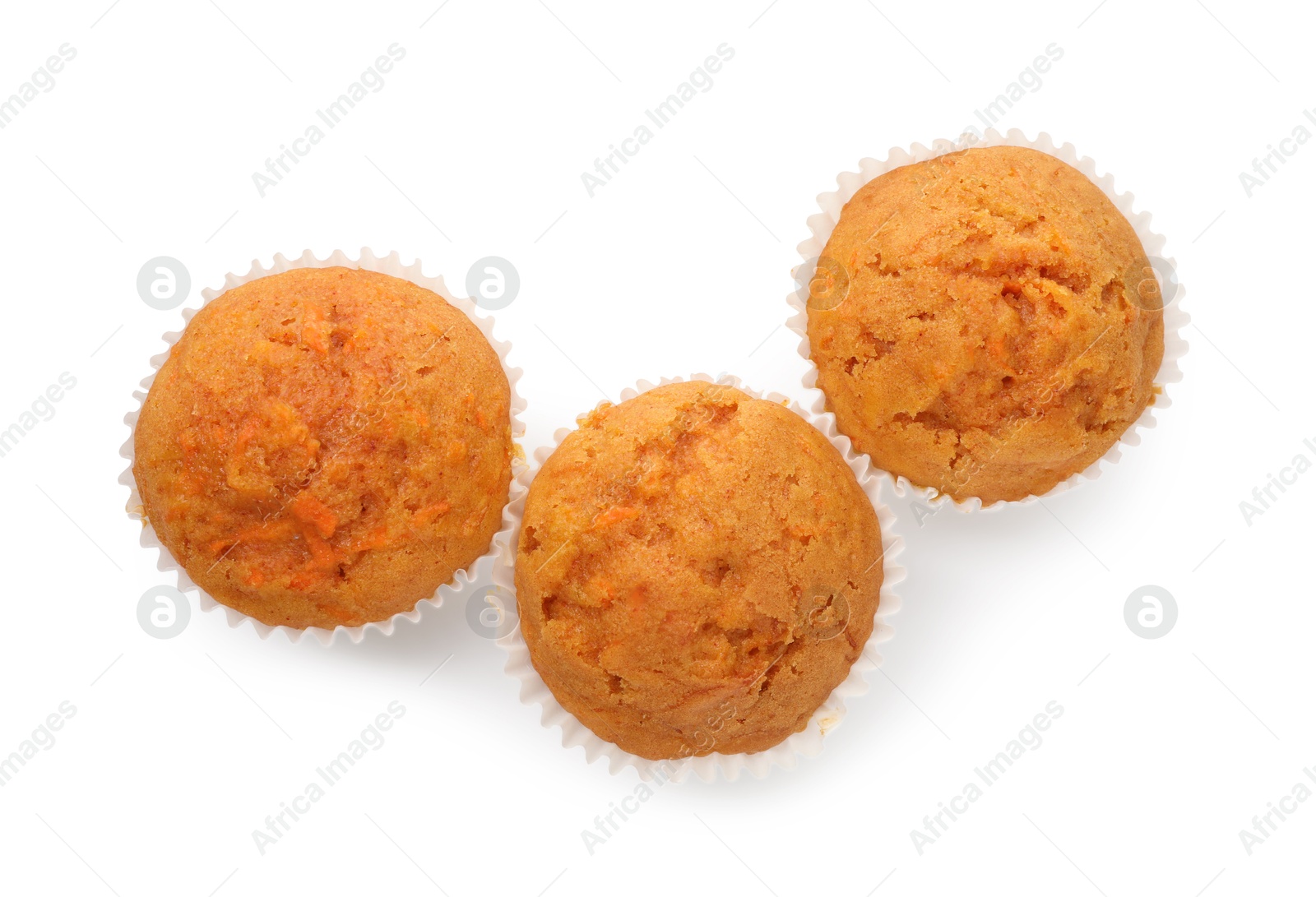 Photo of Tasty carrot muffins isolated on white, top view