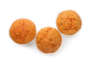 Photo of Tasty carrot muffins isolated on white, top view