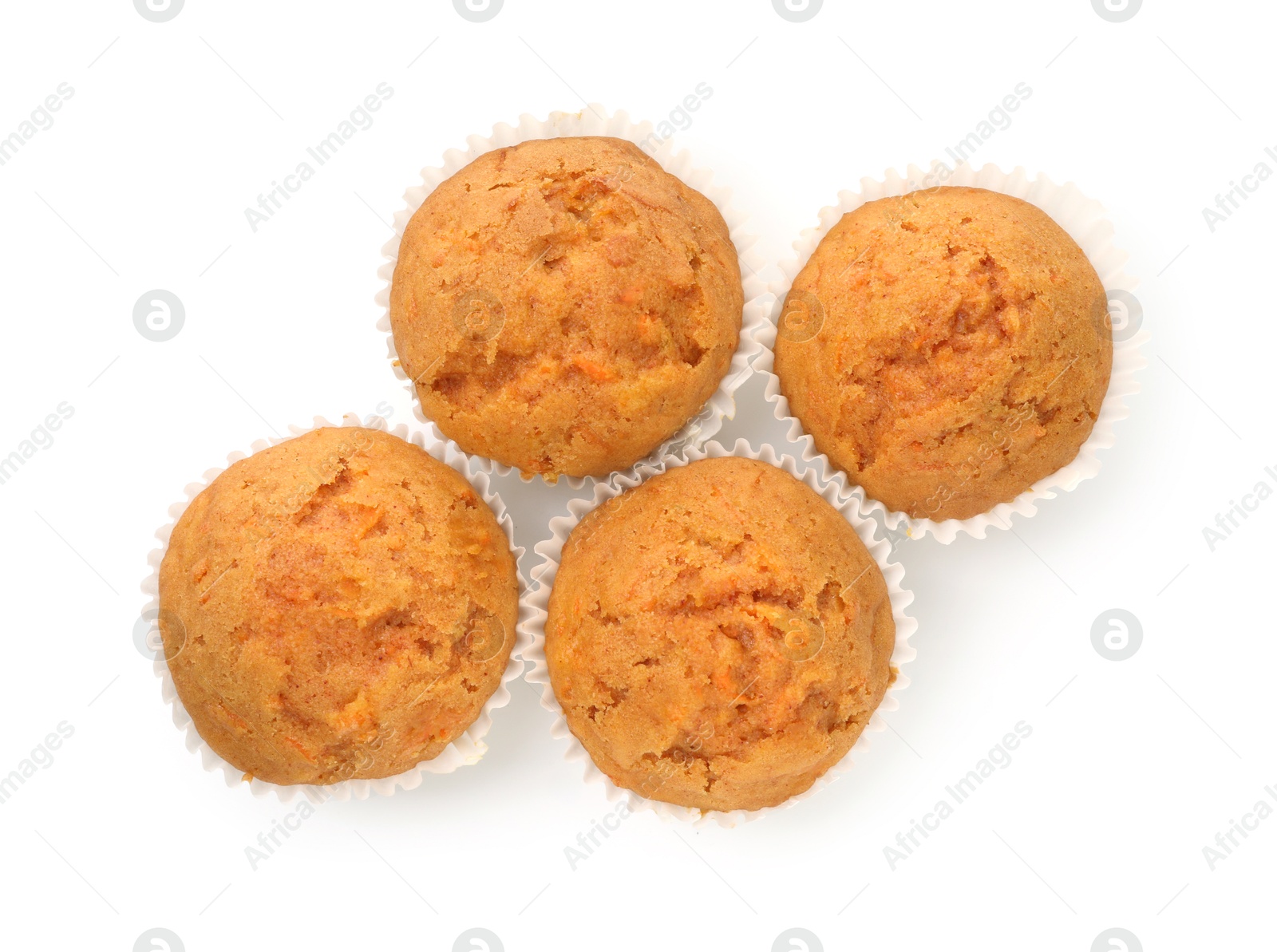 Photo of Tasty carrot muffins isolated on white, top view