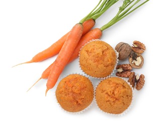 Photo of Tasty carrot muffins, walnuts and fresh vegetables isolated on white, top view