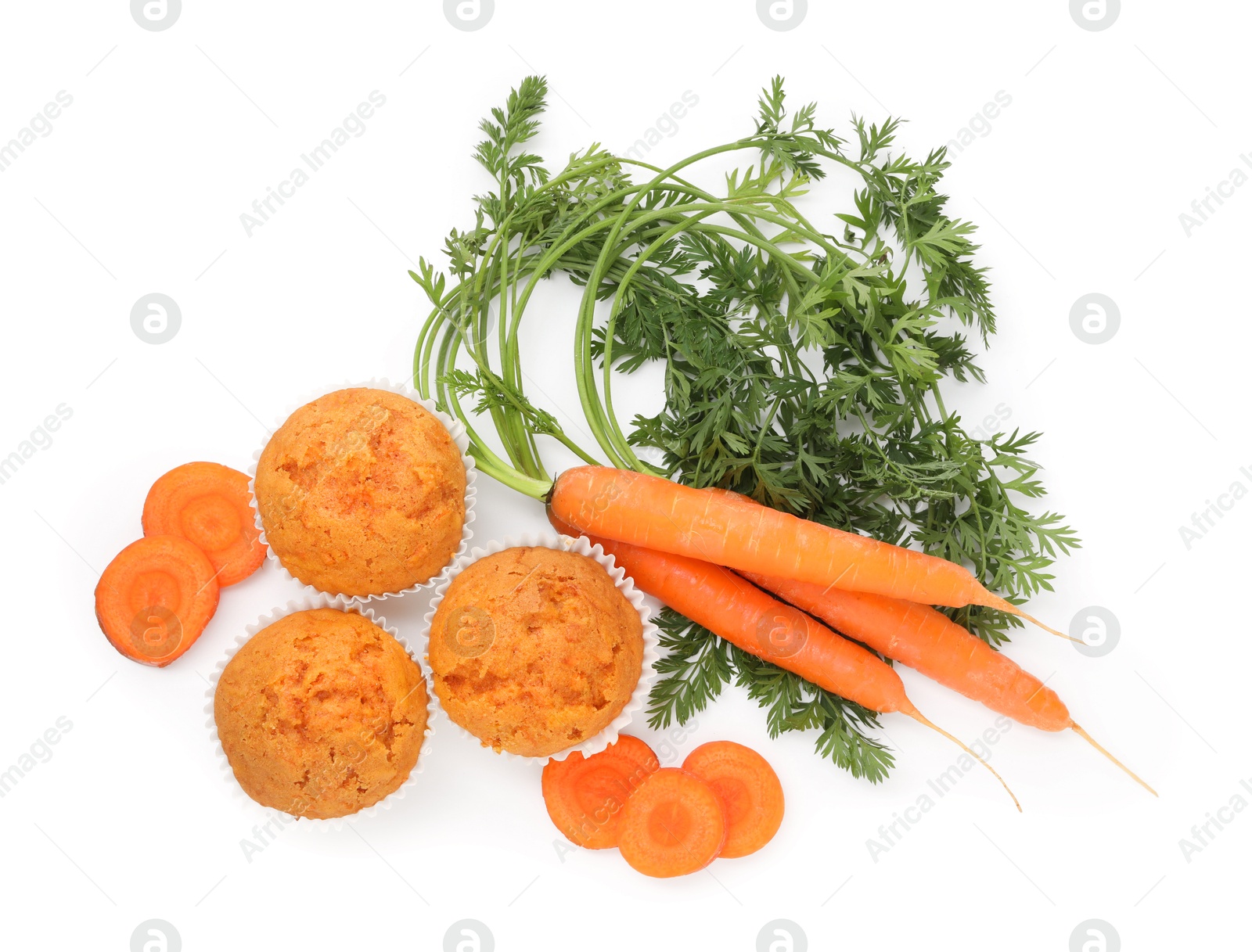 Photo of Tasty carrot muffins and fresh vegetables isolated on white, top view