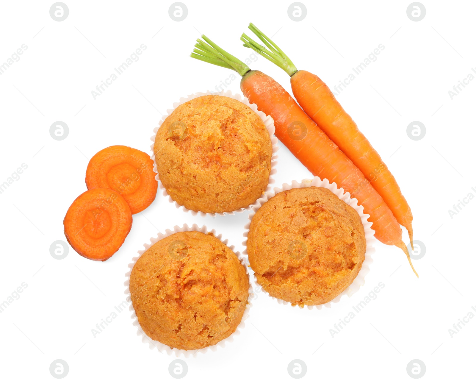 Photo of Tasty carrot muffins and fresh vegetables isolated on white, top view