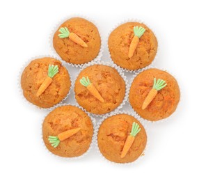 Photo of Tasty carrot muffins isolated on white, top view