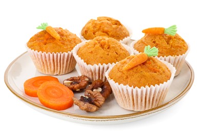 Photo of Tasty carrot muffins, walnuts and cut vegetable isolated on white