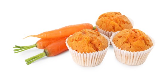 Photo of Tasty carrot muffins and fresh vegetables isolated on white