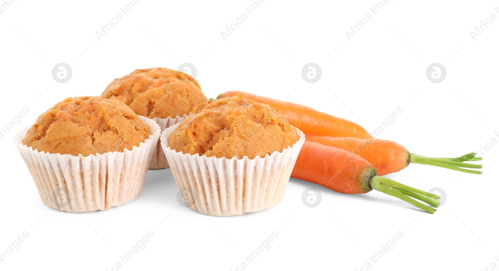 Photo of Tasty carrot muffins and fresh vegetables isolated on white