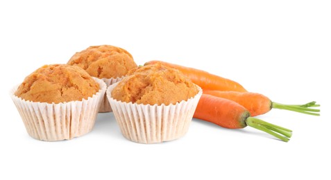 Photo of Tasty carrot muffins and fresh vegetables isolated on white