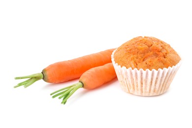 Photo of Tasty carrot muffin and fresh vegetables isolated on white