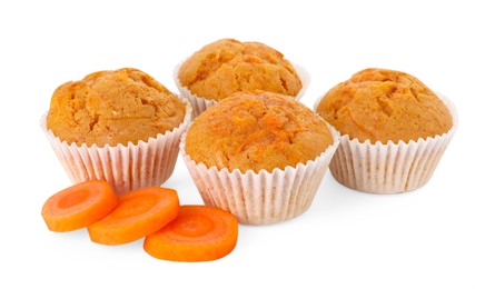 Photo of Tasty carrot muffins and cut vegetable isolated on white