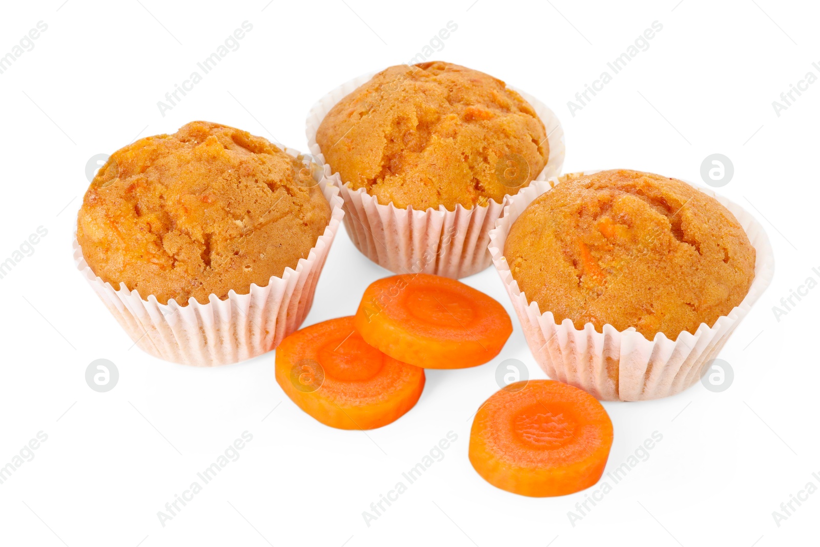 Photo of Tasty carrot muffins and cut vegetable isolated on white