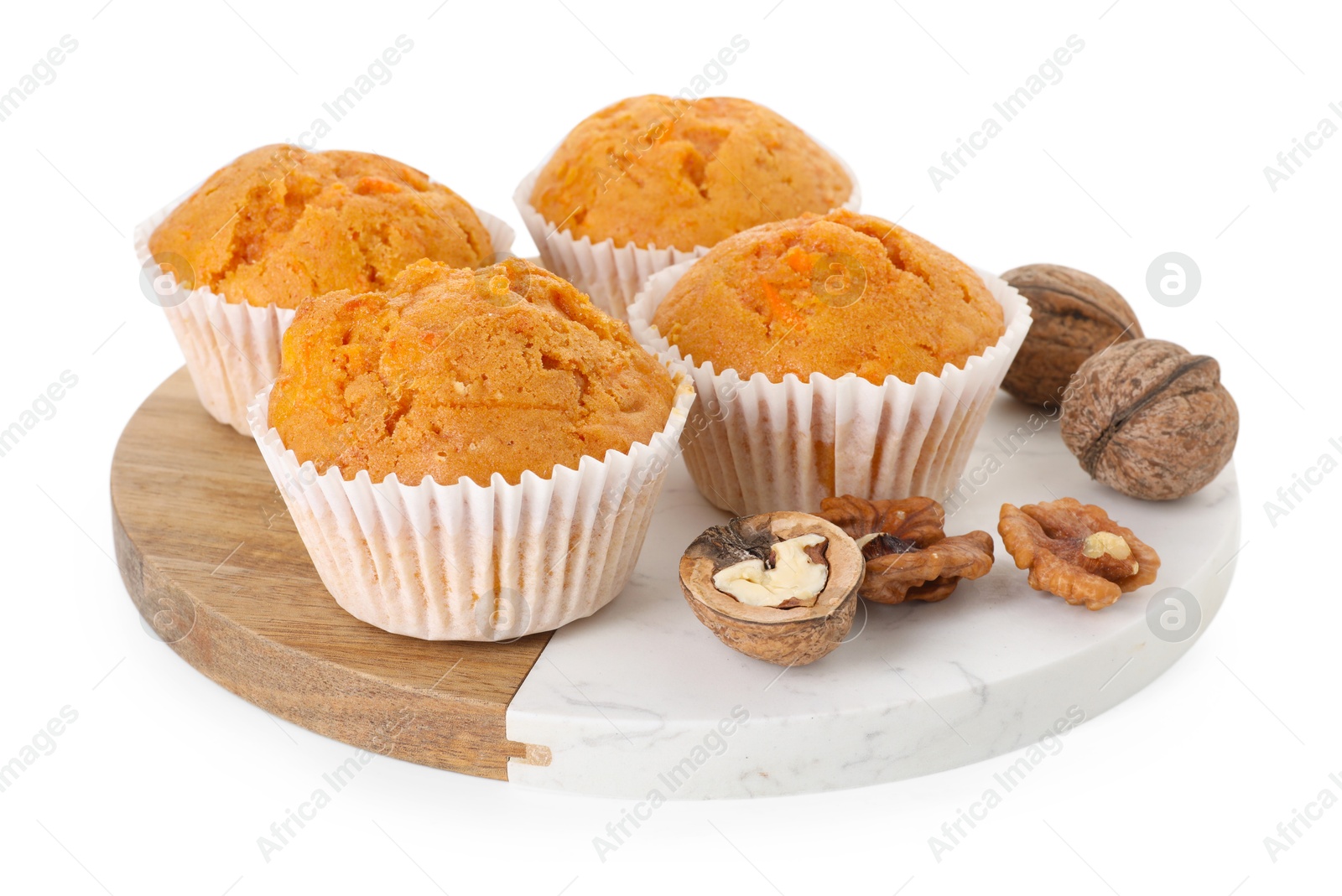 Photo of Tasty carrot muffins and walnuts isolated on white