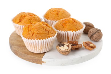 Photo of Tasty carrot muffins and walnuts isolated on white