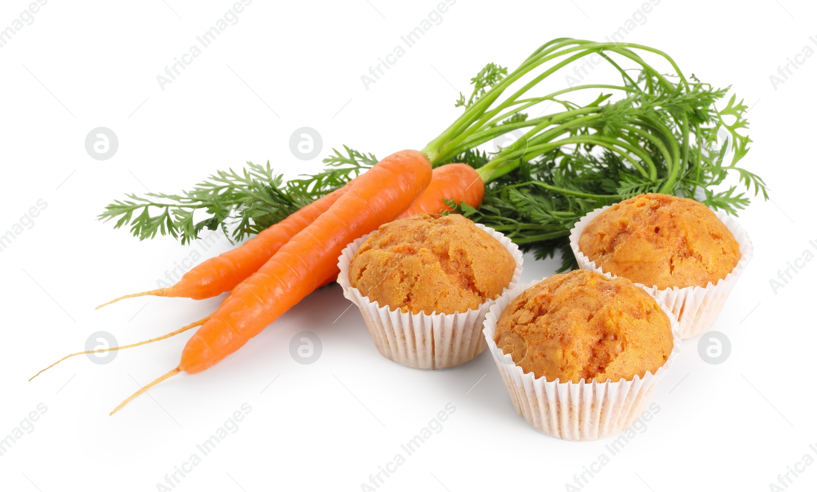 Photo of Tasty carrot muffins and fresh vegetables isolated on white