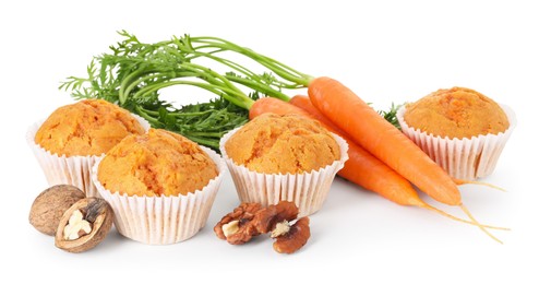 Photo of Tasty carrot muffins, walnuts and fresh vegetables isolated on white