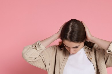 Photo of Girl with hair loss problem on pink background