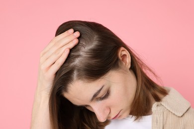 Photo of Girl with hair loss problem on pink background