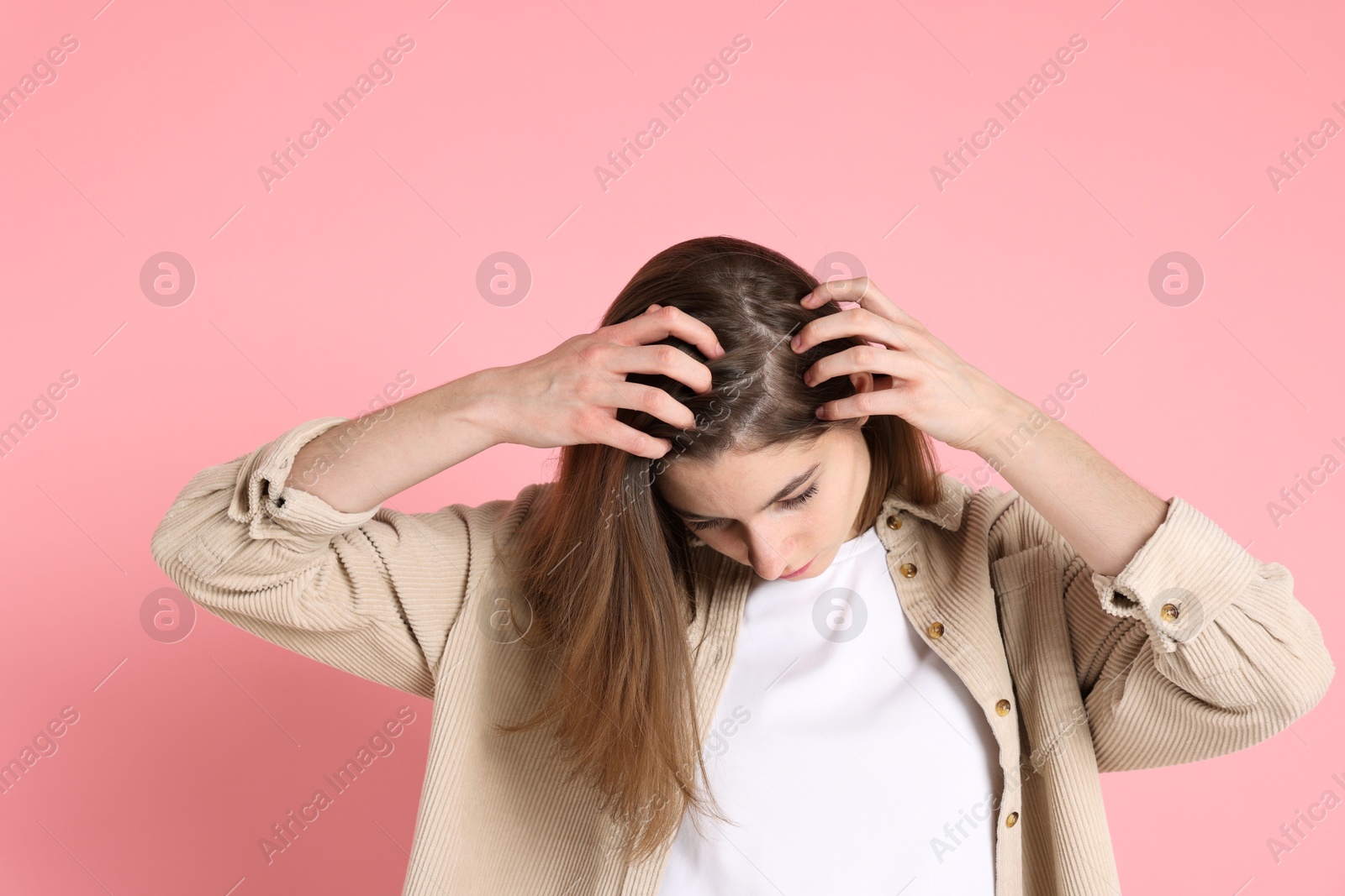 Photo of Girl with hair loss problem on pink background