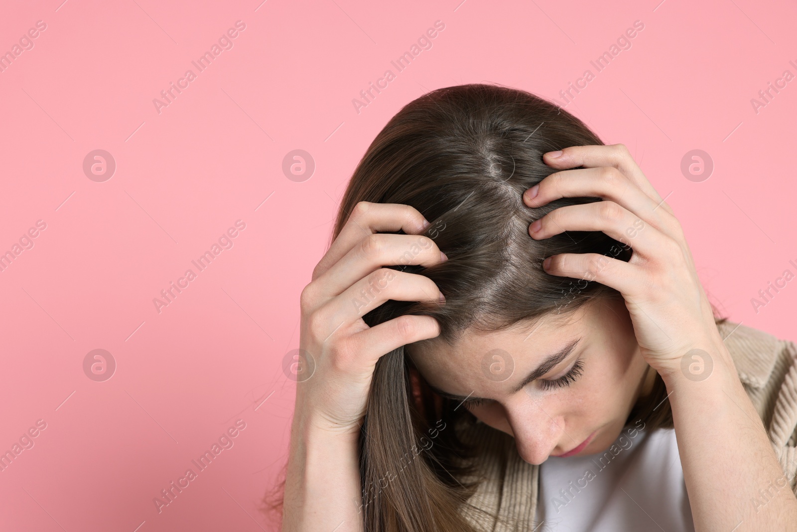 Photo of Girl with hair loss problem on pink background, space for text