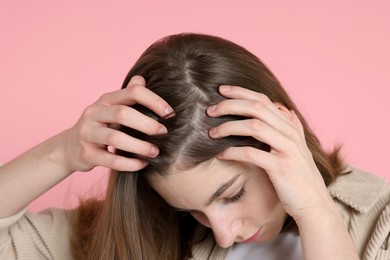 Photo of Girl with hair loss problem on pink background