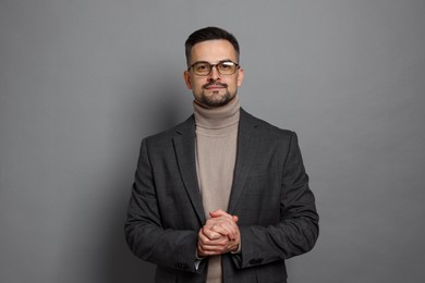 Photo of Portrait of handsome middle aged man on grey background