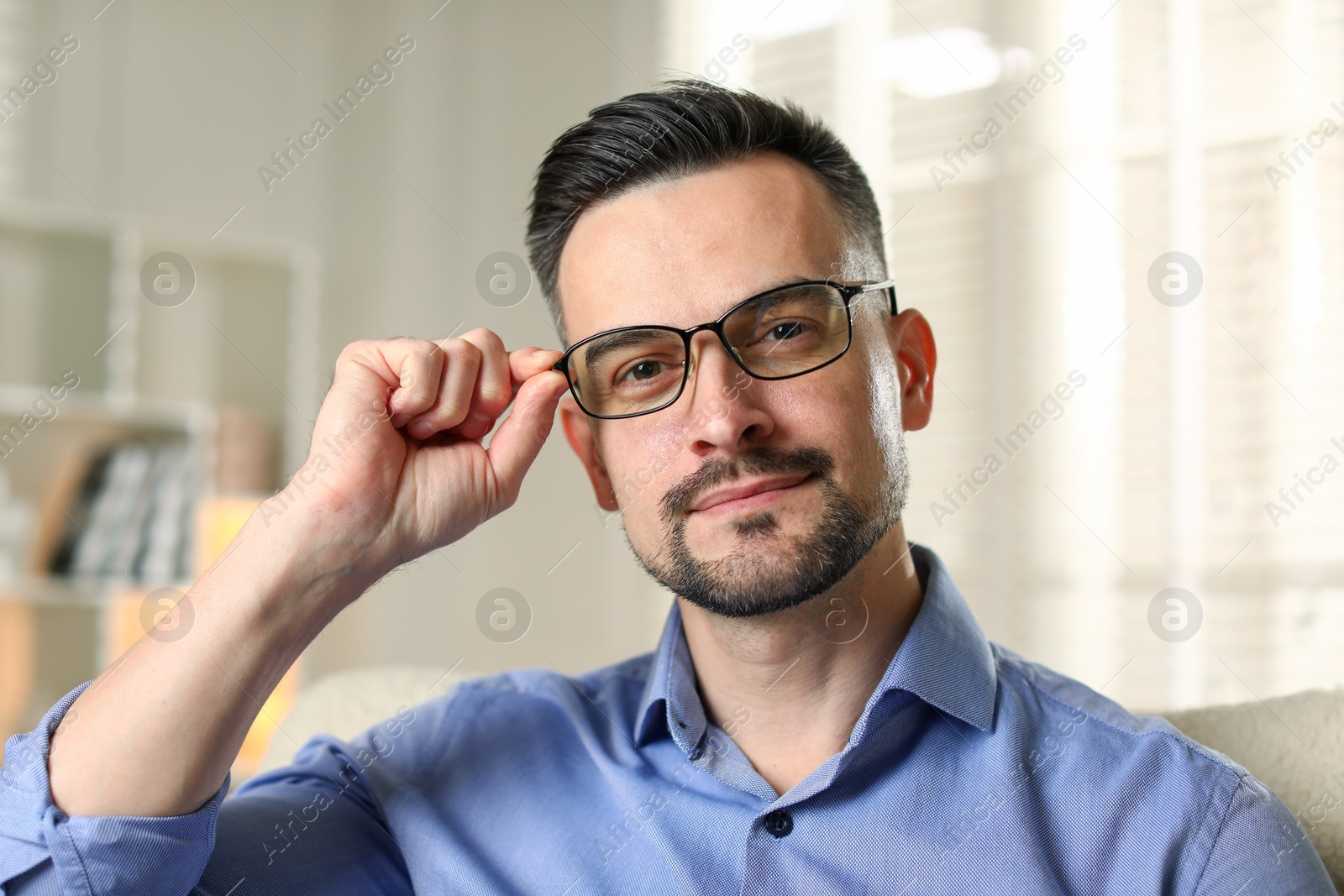 Photo of Portrait of handsome middle aged man indoors