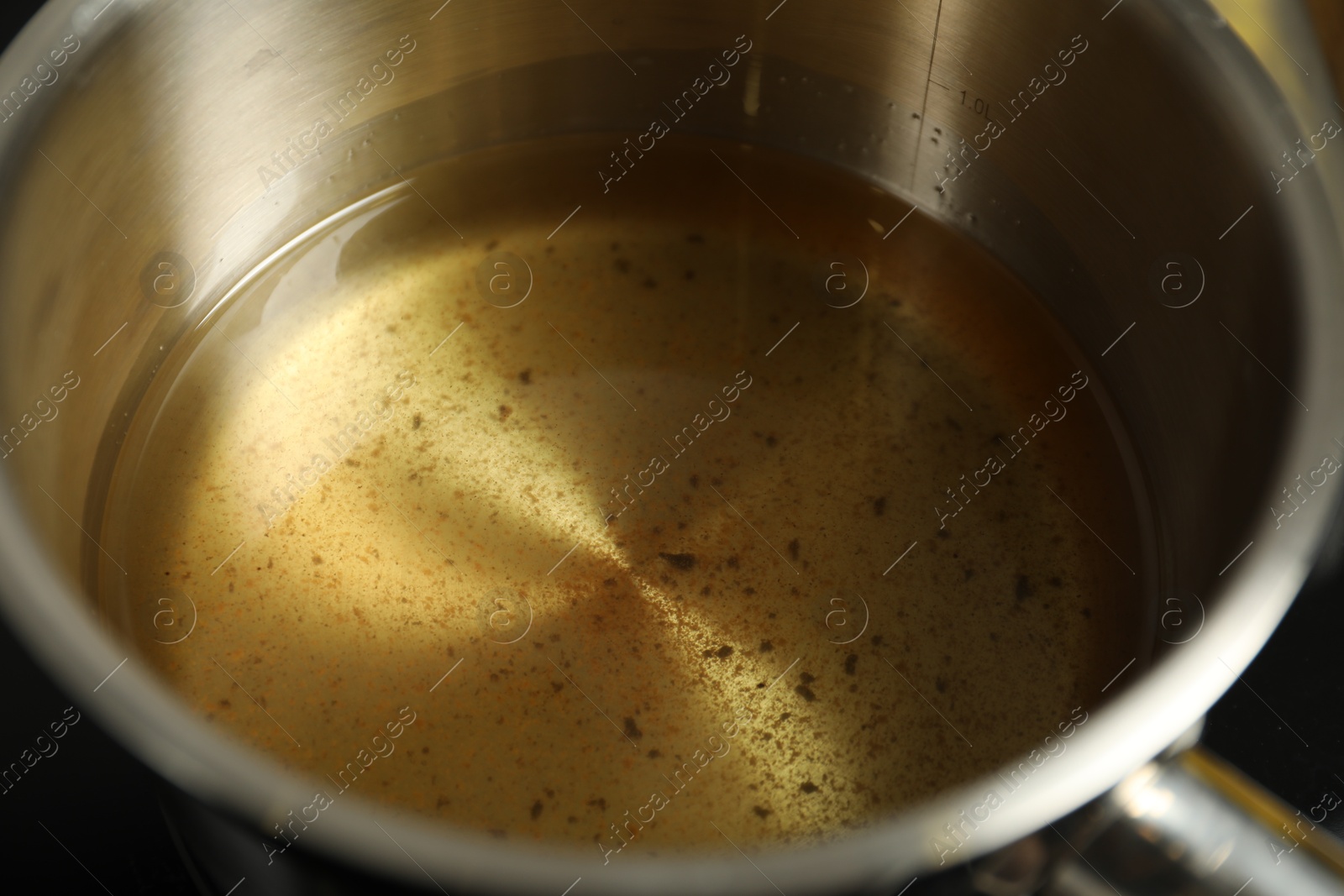 Photo of Used cooking oil in saute pan, closeup