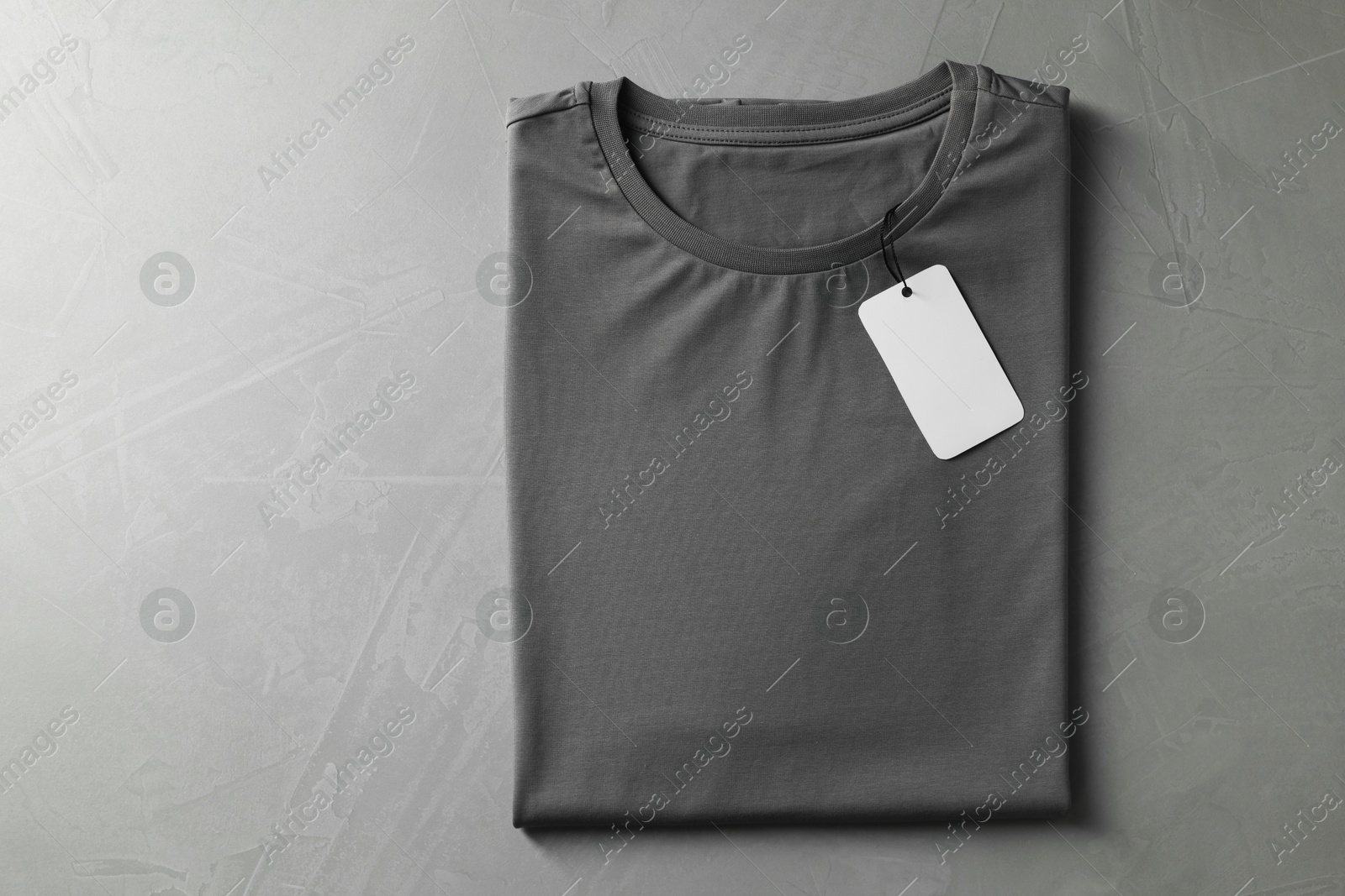 Photo of Blank t-shirt on grey background, top view. Mockup for design