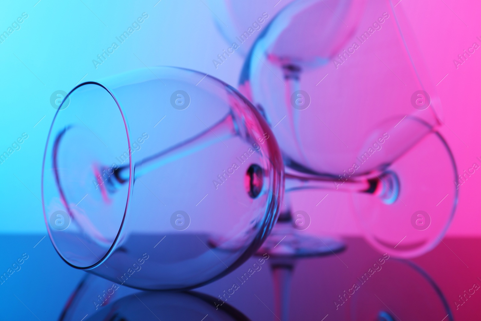 Photo of Empty glasses on table, color tone effect