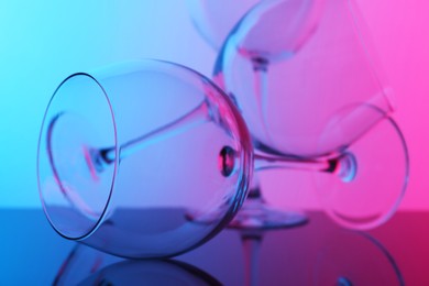 Photo of Empty glasses on table, color tone effect