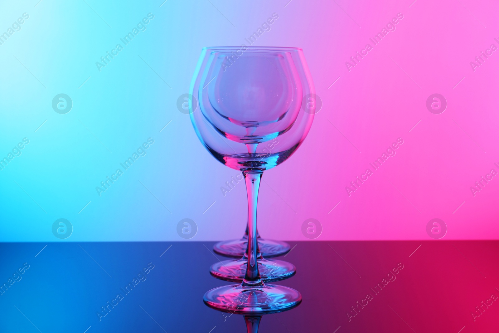 Photo of Empty glasses on table, color tone effect