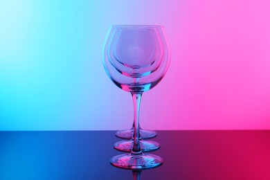 Photo of Empty glasses on table, color tone effect