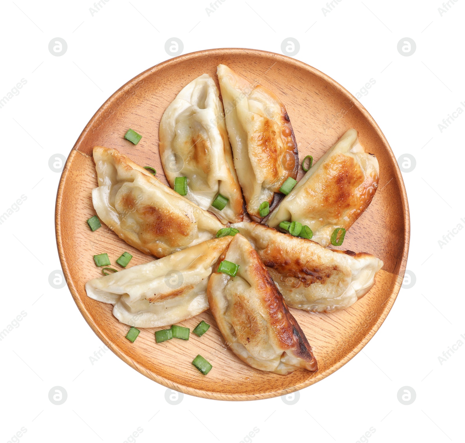 Photo of Delicious fried gyoza dumplings with green onions isolated on white, top view