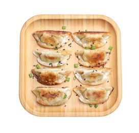 Photo of Delicious fried gyoza dumplings with green onions and sesame seeds isolated on white, top view