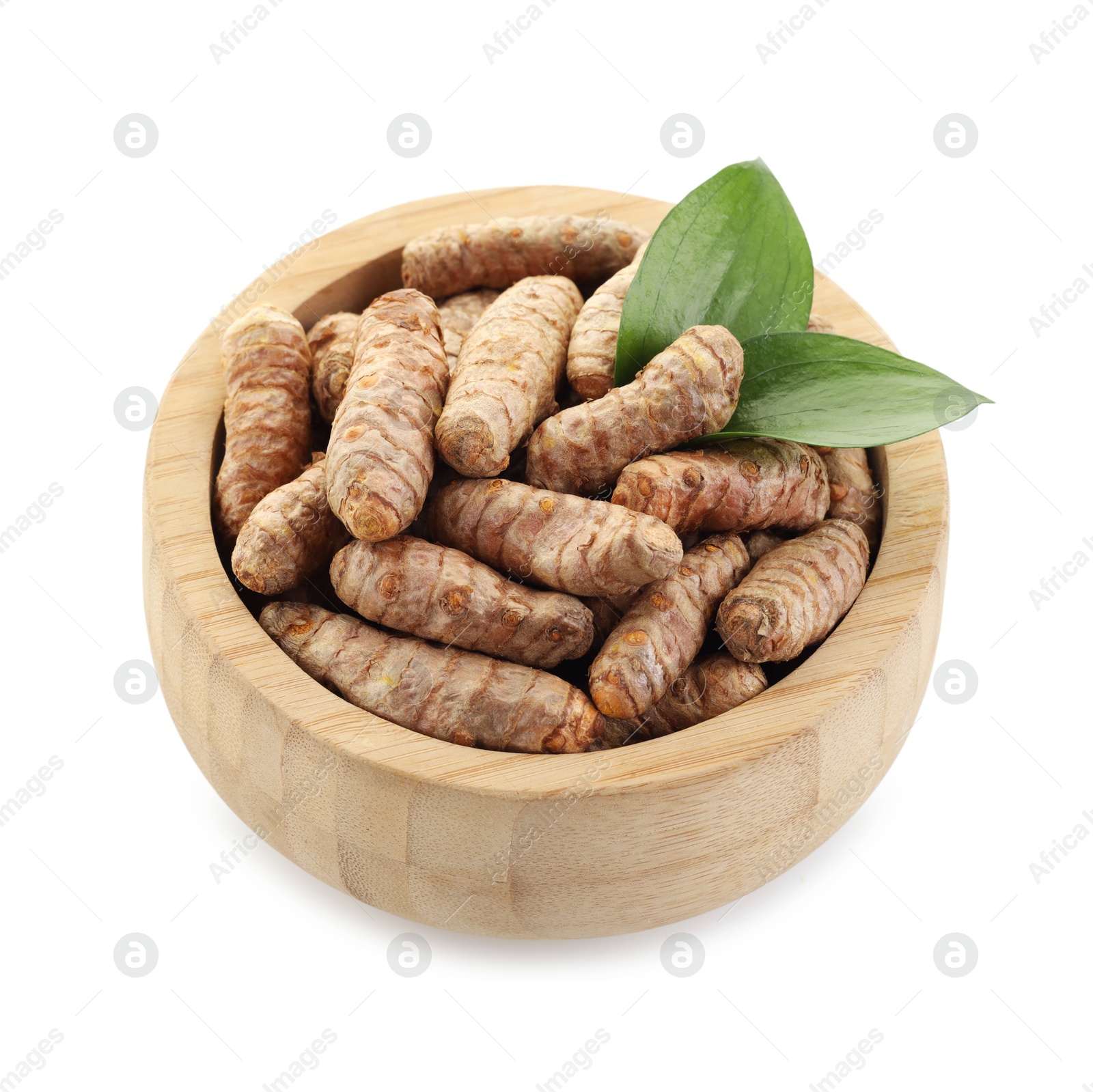 Photo of Tumeric rhizomes in bowl and leaves isolated on white